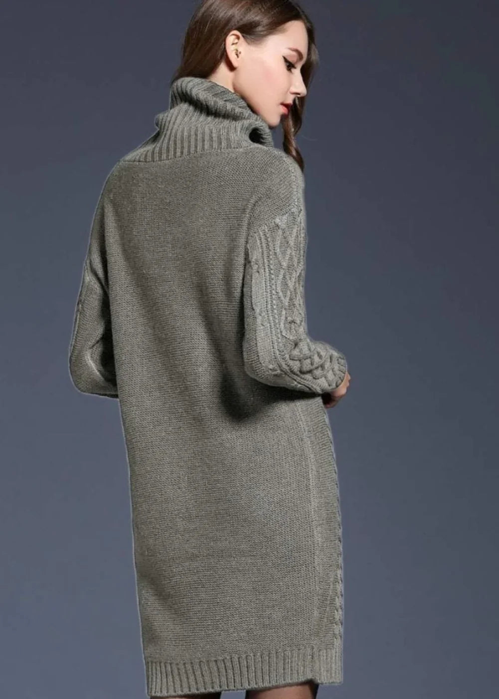 Gray knit sweater dress with turtleneck and cable knit sleeves on model.