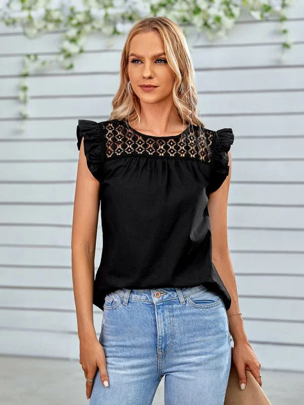 Black sleeveless top with eyelet detail at neckline and ruffled sleeves, paired with light wash jeans.