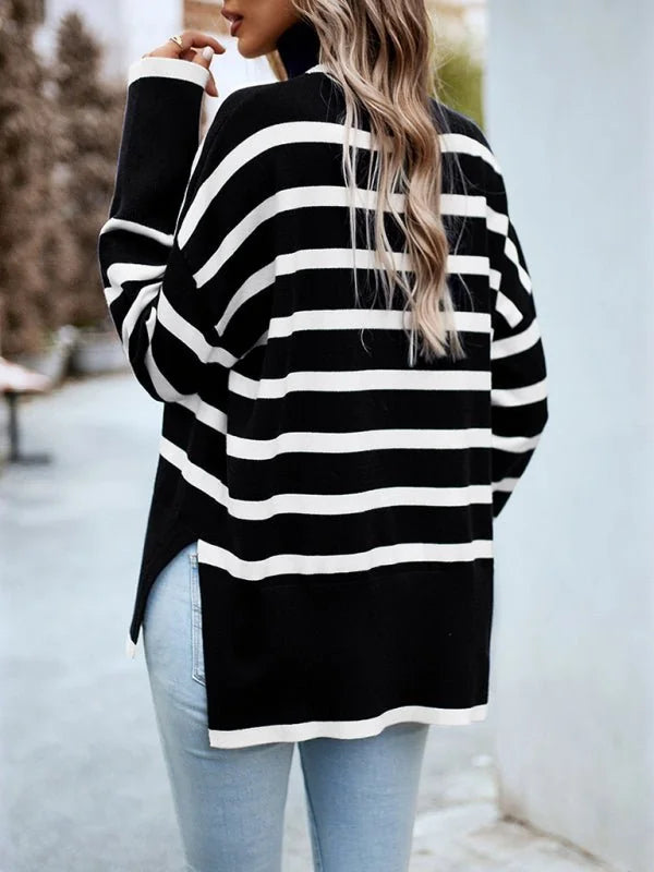 Black and white striped turtleneck sweater with side slits on model