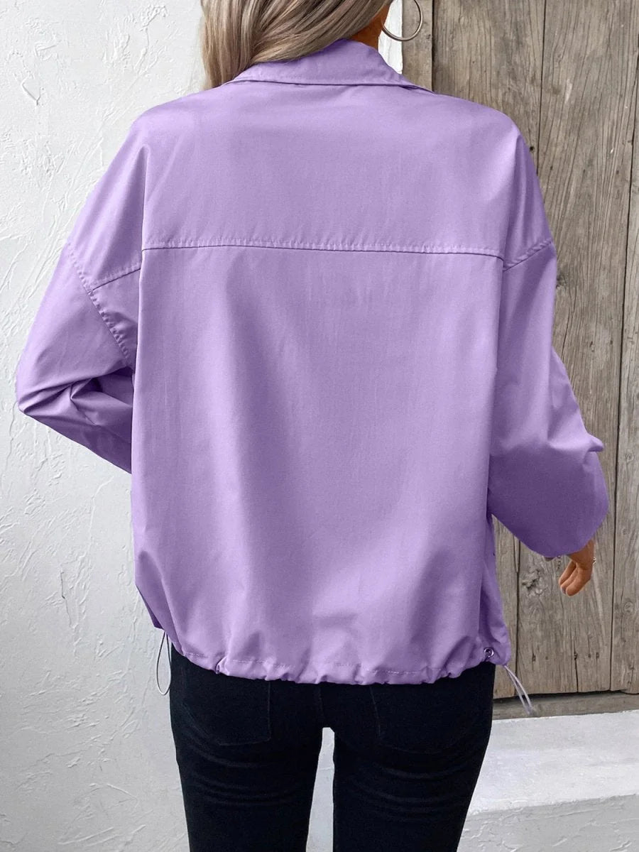 Back view of a lavender polyester jacket with a drawstring hem and a horizontal seam detail.
