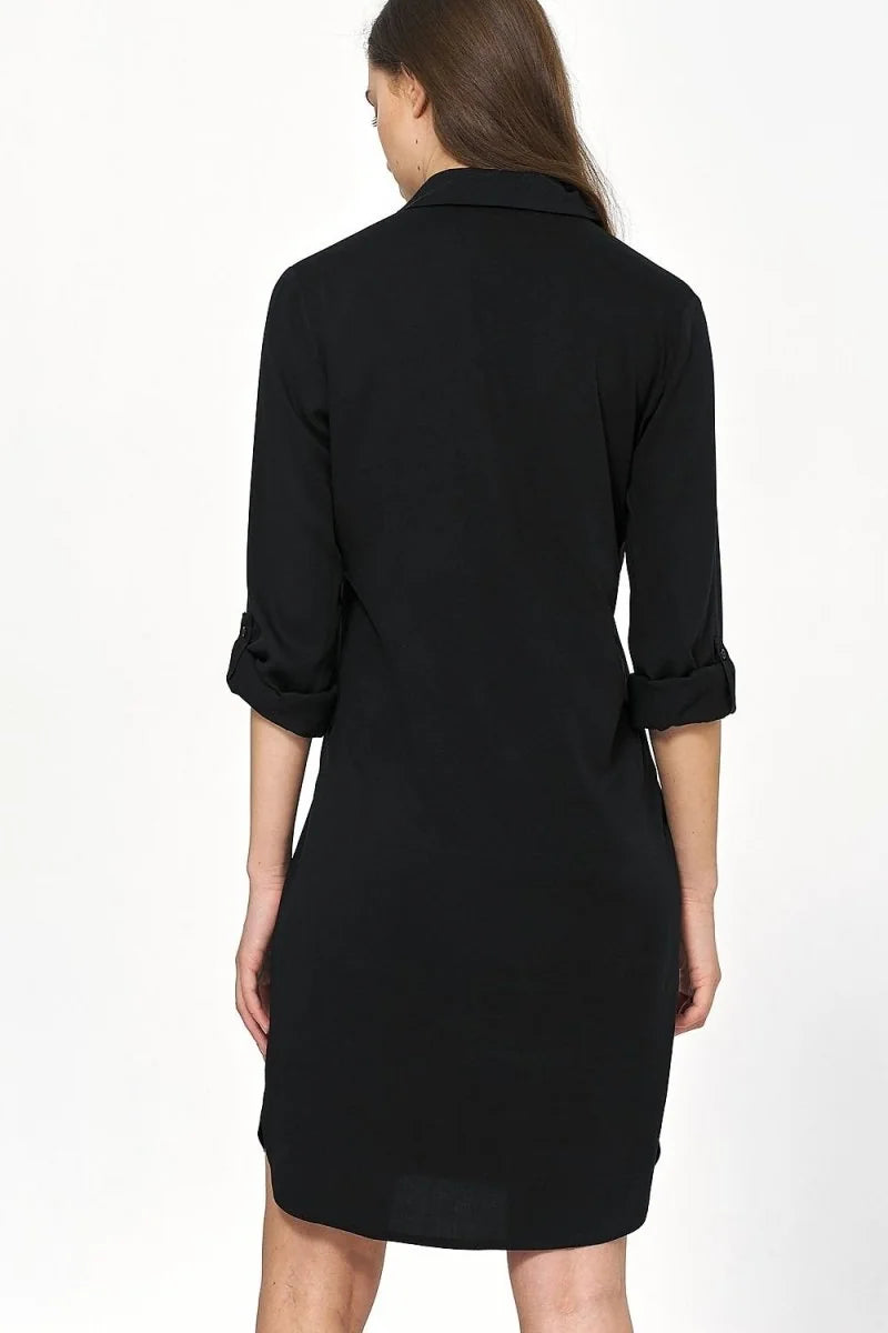 Black oversized viscose shirt dress with rolled-up sleeves, shown from the back.