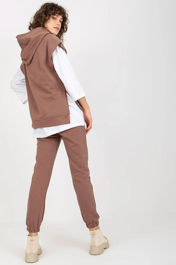 Brown cotton-blend joggers with a relaxed fit and cuffed ankles, shown on a model.