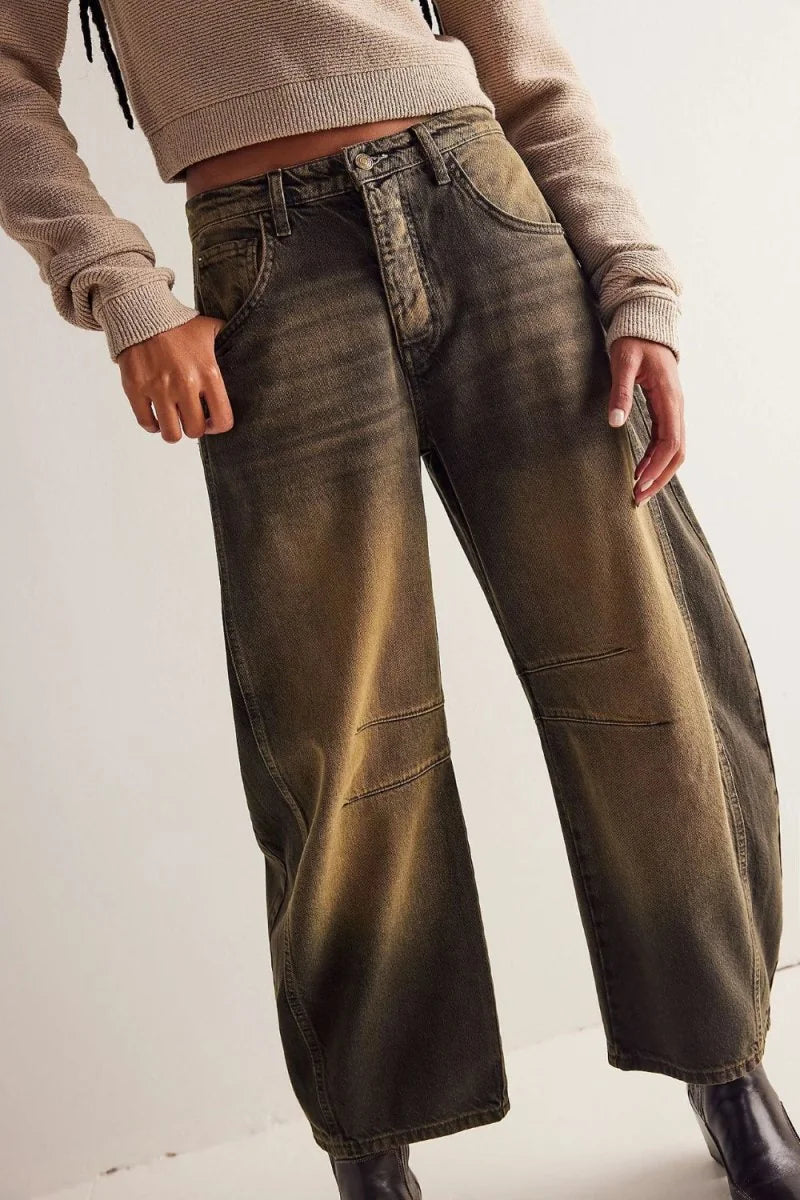 Relaxed fit, wide-leg jeans in a washed brown and black denim with paneled knees.
