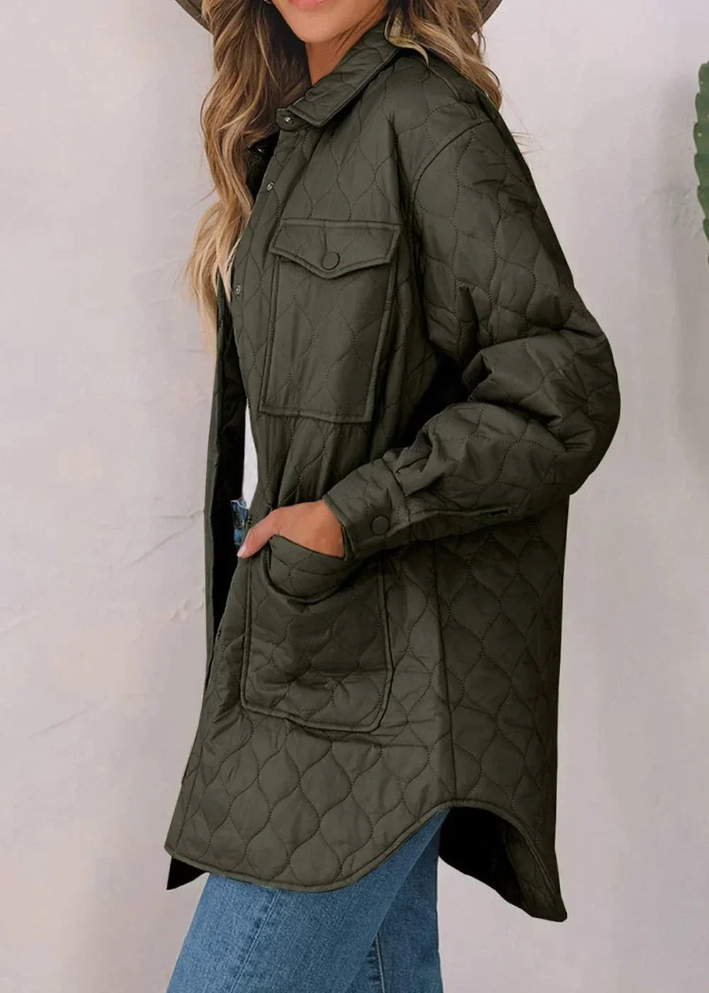 Olive green quilted jacket with diamond pattern, button-front, and chest pockets, on a model.