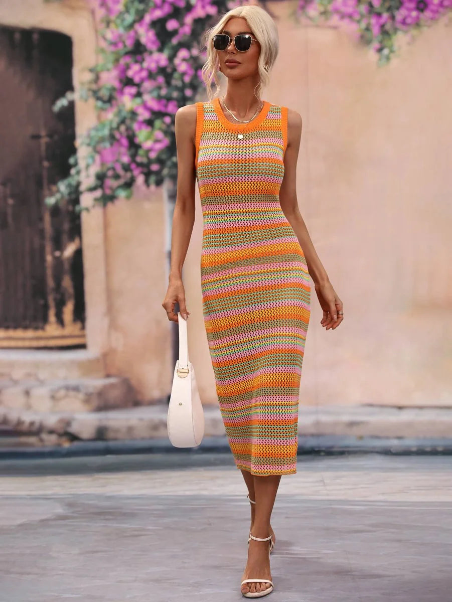 Crocheted striped knit dress in orange, pink, and green, featuring a sleeveless design, midi length, and a white handbag.