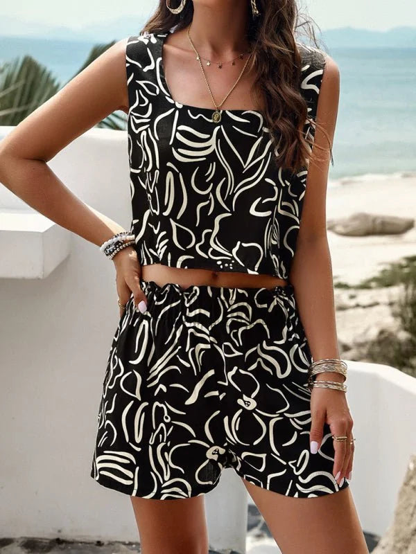 Black and white abstract floral print viscose crop top and shorts set on model.