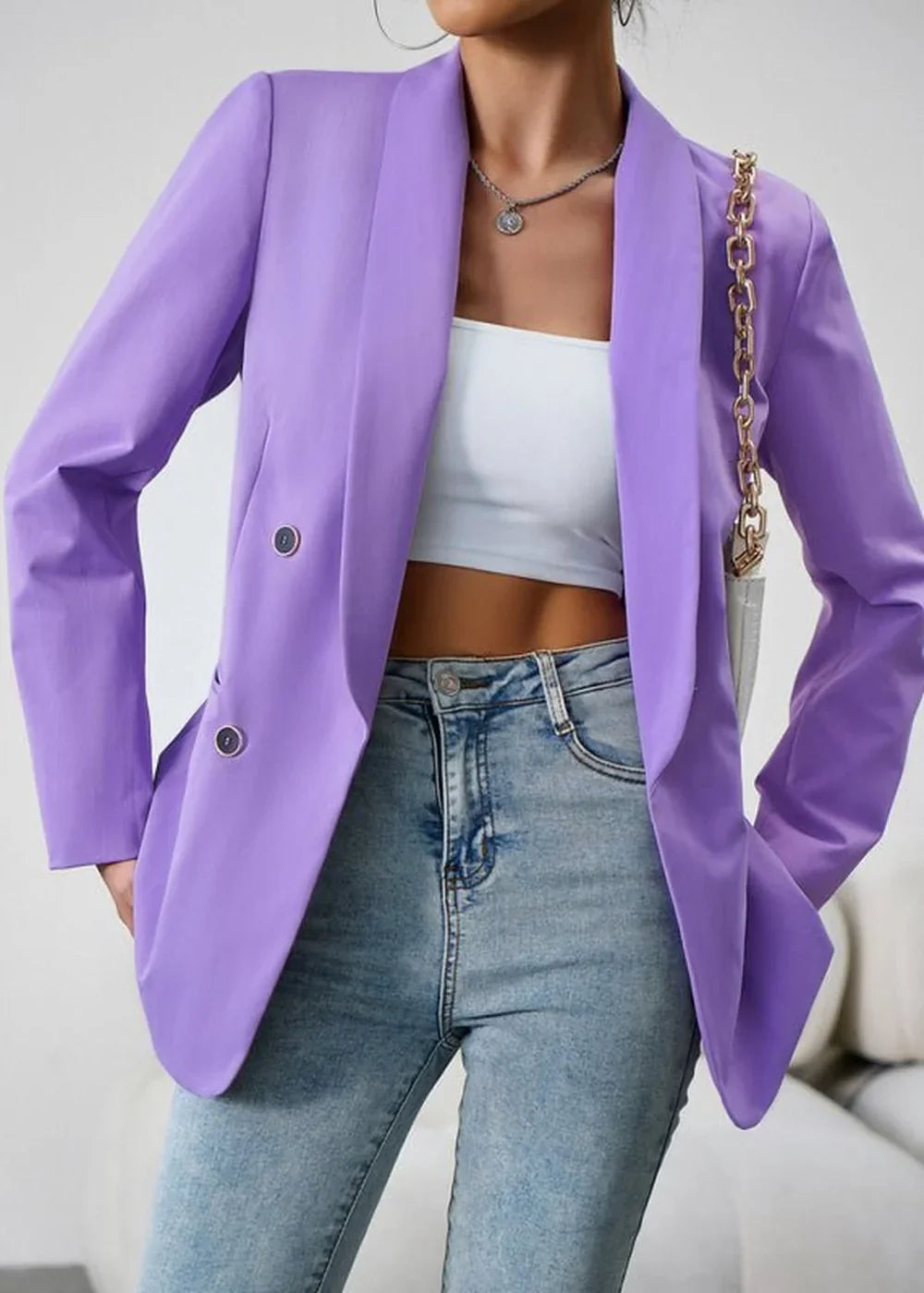 Lavender double-breasted blazer with a white crop top and light wash jeans on a model.
