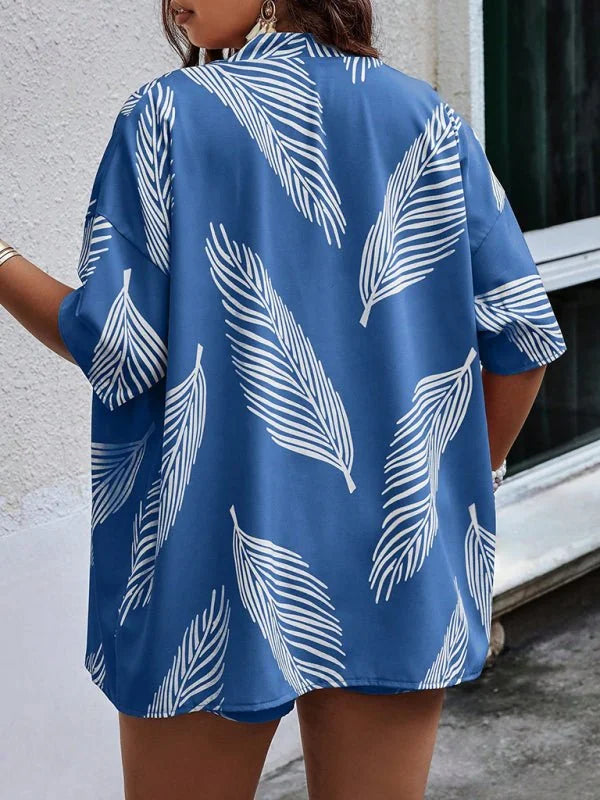 Blue short suit with white feather print, relaxed fit, short sleeves.