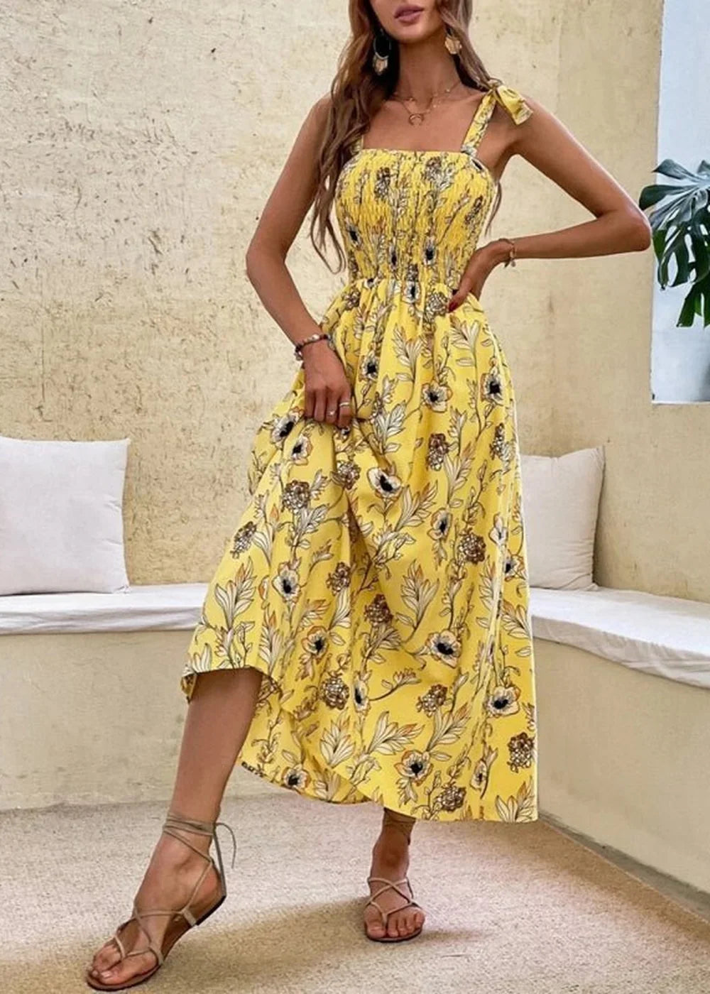 Yellow floral print midi dress with smocked bodice and tie straps.