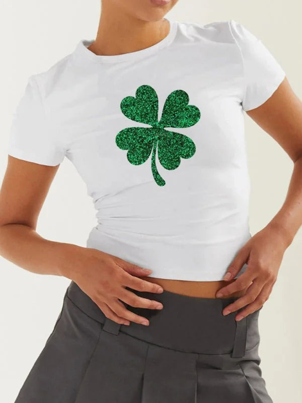 White cropped t-shirt with a sparkly green four-leaf clover print.