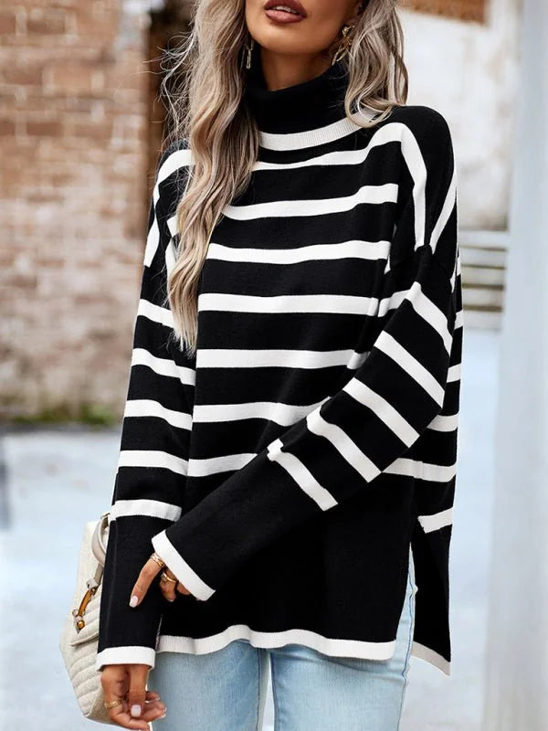 Black and white striped turtleneck sweater with a relaxed fit and side slits.