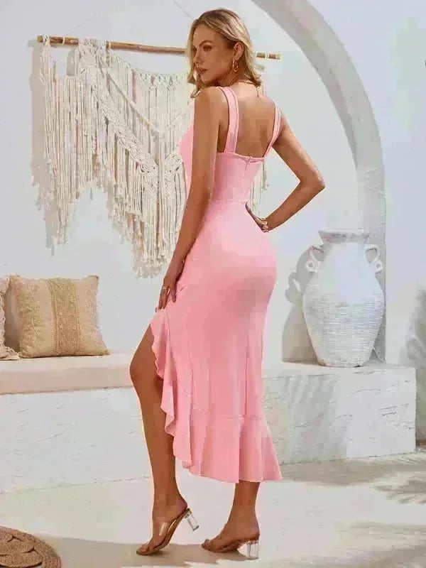Pink ruffled midi dress with a thigh-high slit, shown on a model.