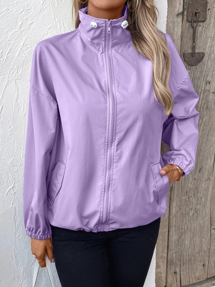 Light purple polyester jacket with a full zip front and cinched cuffs on a model.