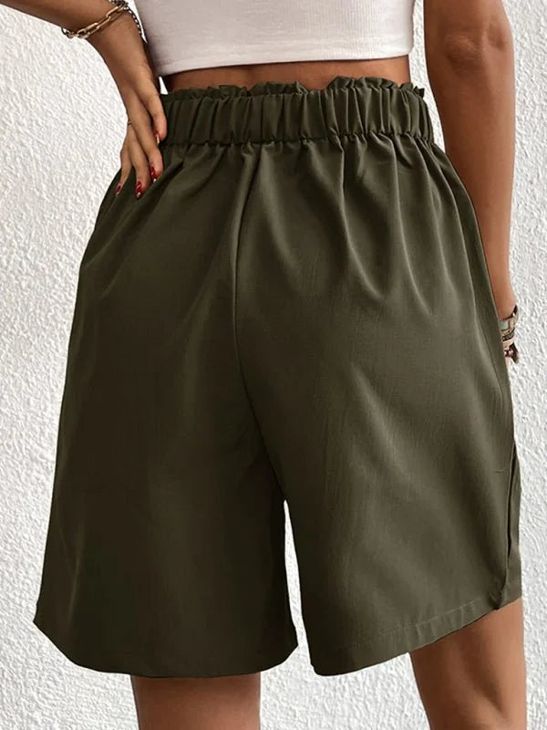 Olive green shorts with a ruffled elastic waistband, shown from the back.