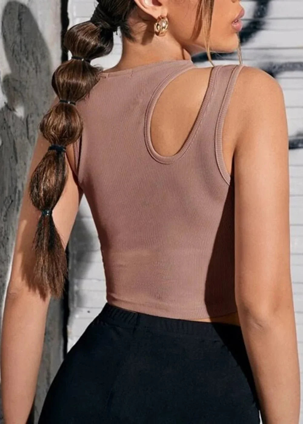 Back view of a mocha-brown ribbed knit tank top with a cutout detail on the shoulder.
