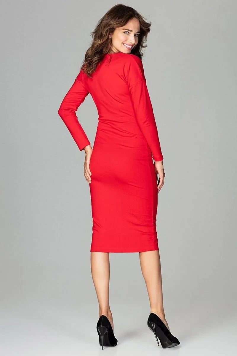 Woman in a form-fitting red long-sleeve dress and black high heels.