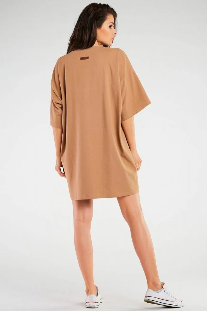 Camel t-shirt dress with a relaxed fit, back view on a model.