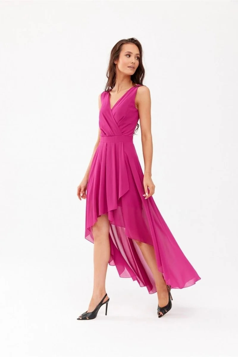 Fuchsia asymmetrical hem dress with V-neck and ruched bodice, worn with black slingback heels.