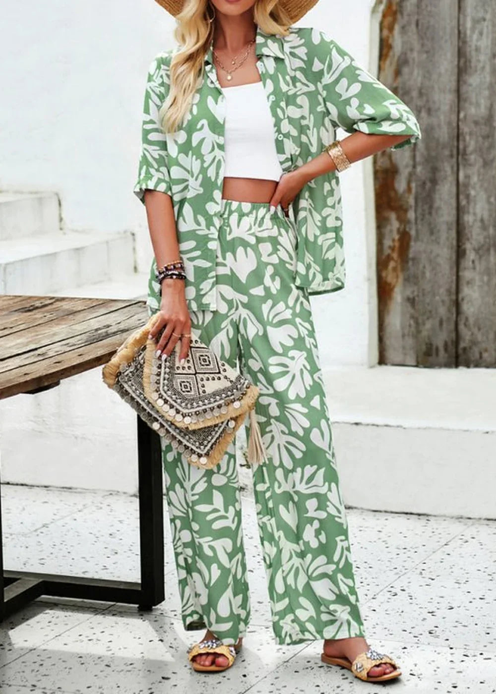 Green and white floral print viscose pant suit with a cropped top and wide-leg pants.