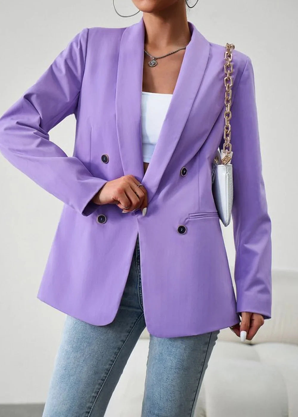 Lavender double-breasted blazer with dark buttons, worn by a model with a white top and jeans.