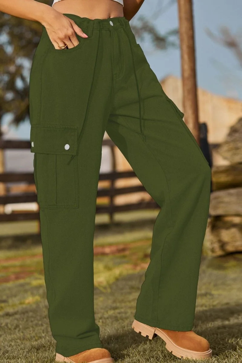 Olive green cargo pants with a drawstring waist and buttoned pockets, shown on a model.