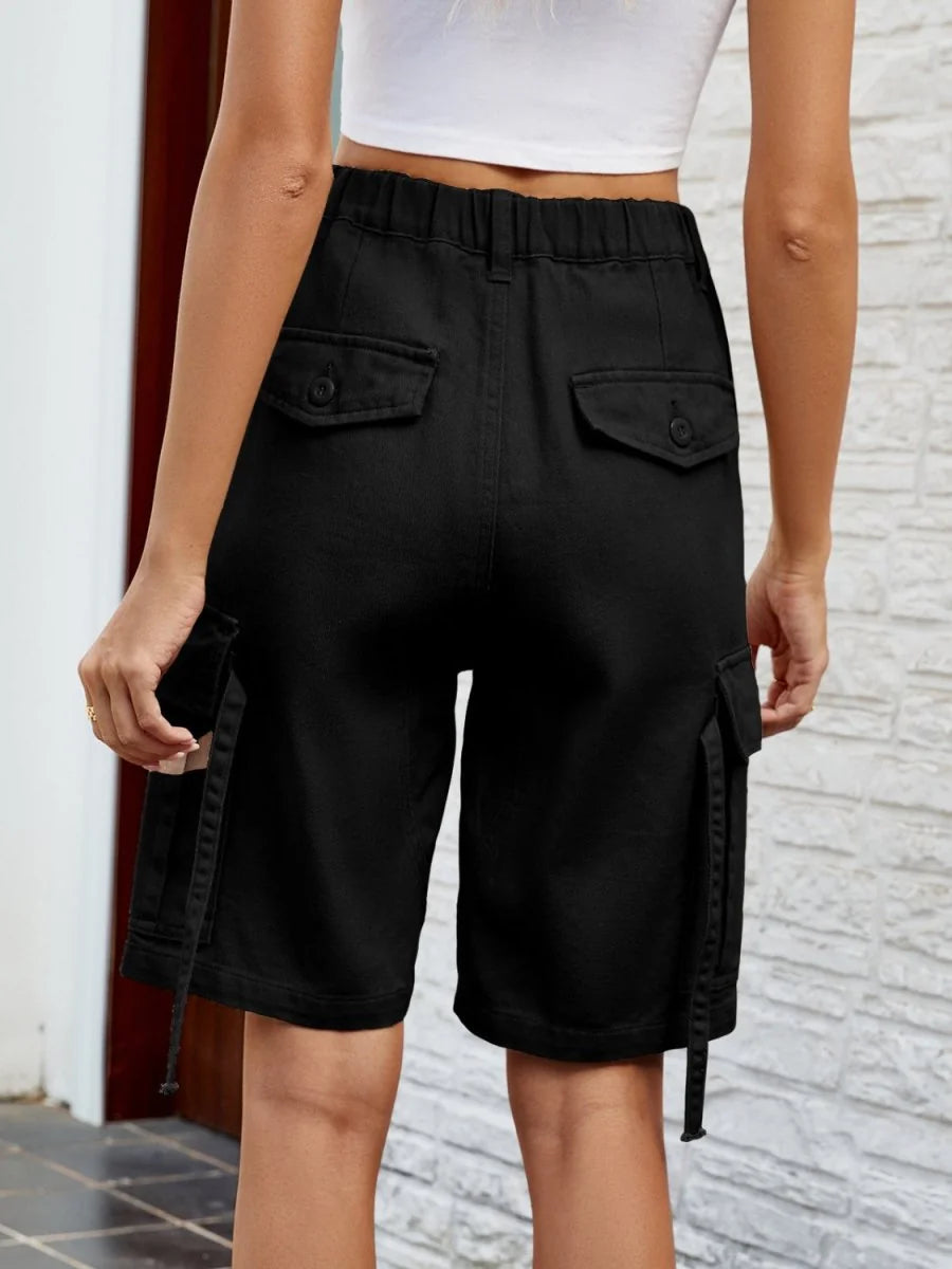 Black cargo shorts with button flap pockets and drawstring hems, shown from the back.