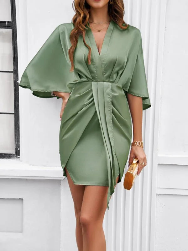 Sage green satin wrap dress with draped detailing and kimono sleeves.