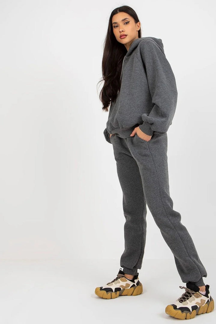 Dark gray cotton-blend sweatpants with a regular fit on a model.