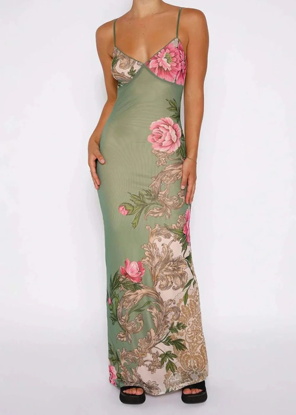 Long green mesh dress with pink floral print and ornate gold detailing, slim fit on model.