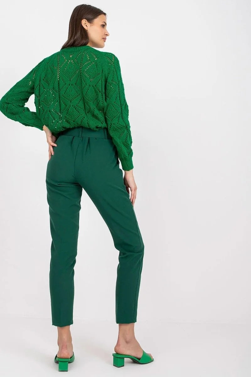 Emerald green high-waisted pants with a belted waist, shown from the back on a model.