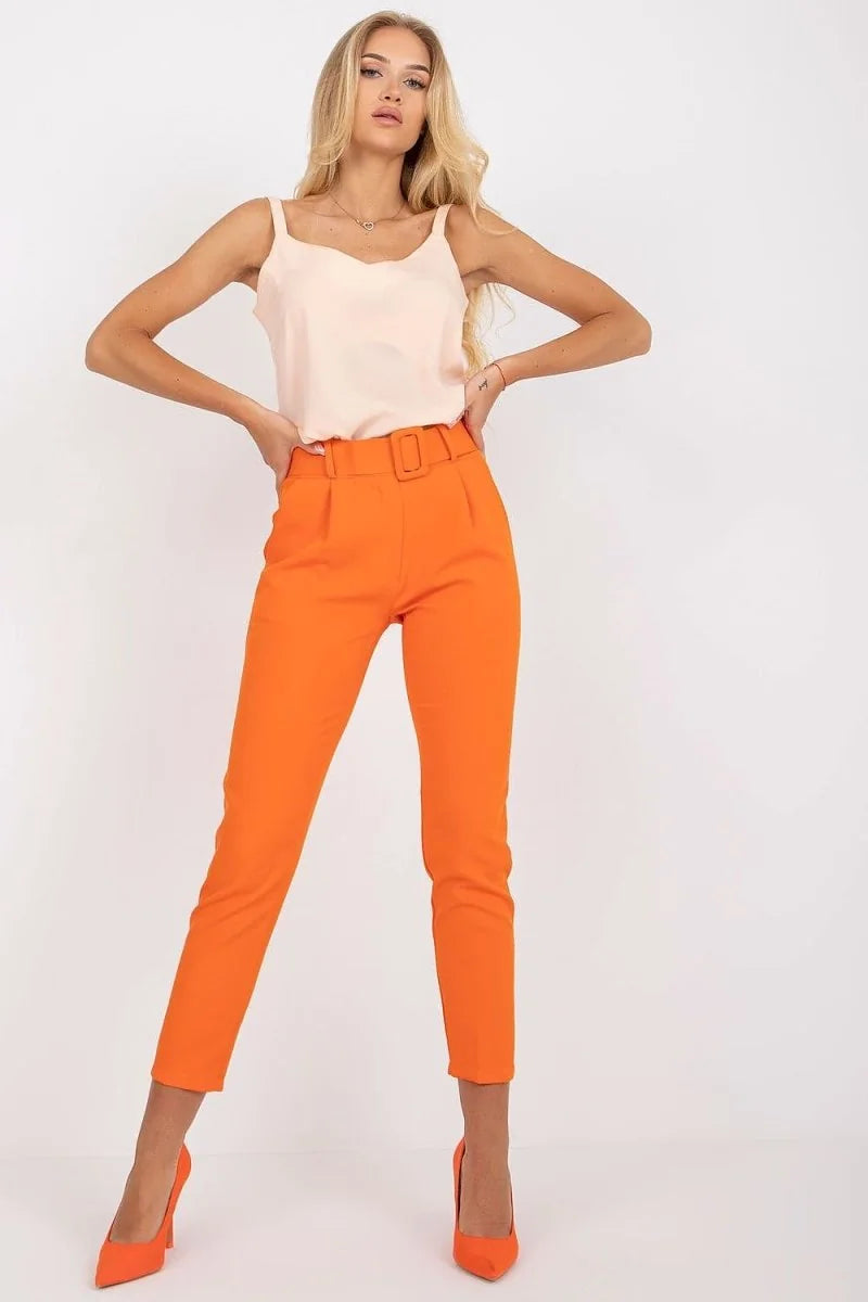 Orange high-waisted belted pants with a regular fit, shown on a model.