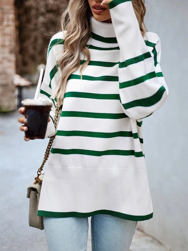 White and green striped turtleneck sweater with balloon sleeves, worn by a model holding a drink.