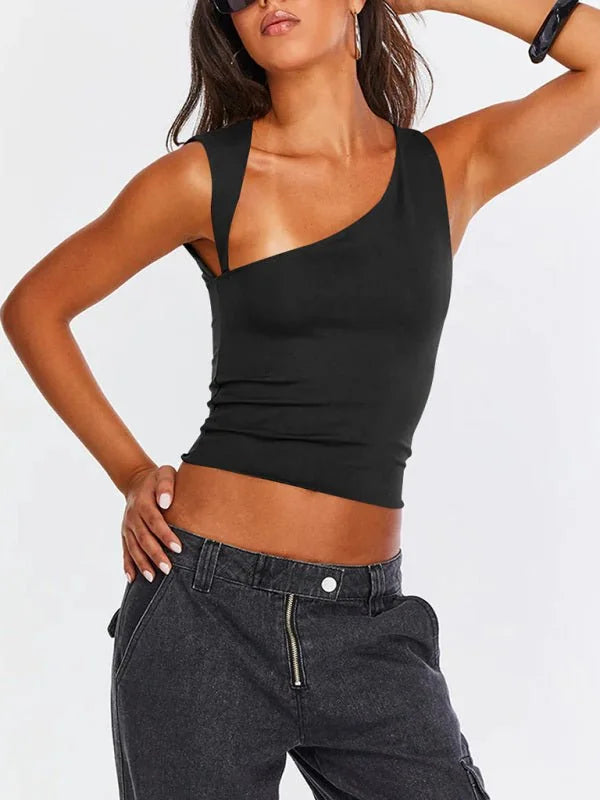 Black one-shoulder tank top with a cutout detail on a model wearing dark wash denim pants.