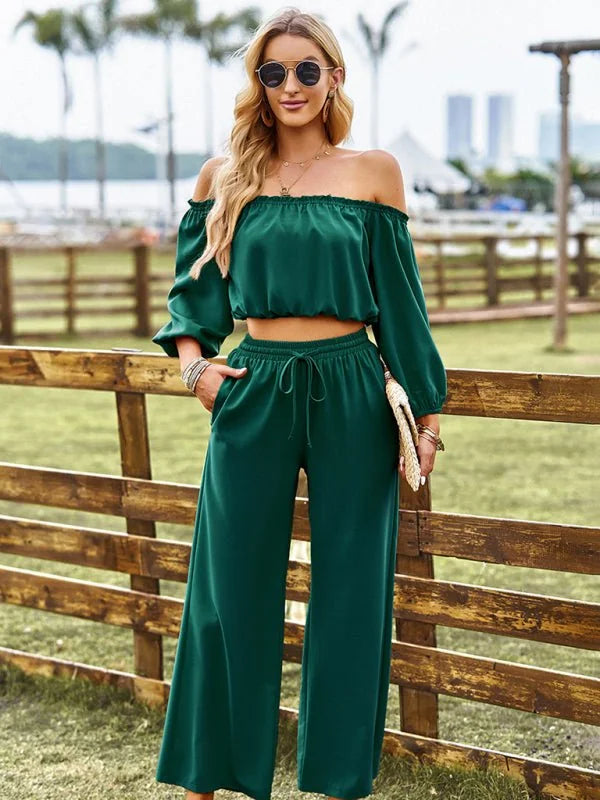 Emerald green off-the-shoulder crop top and wide-leg pants set on a model.