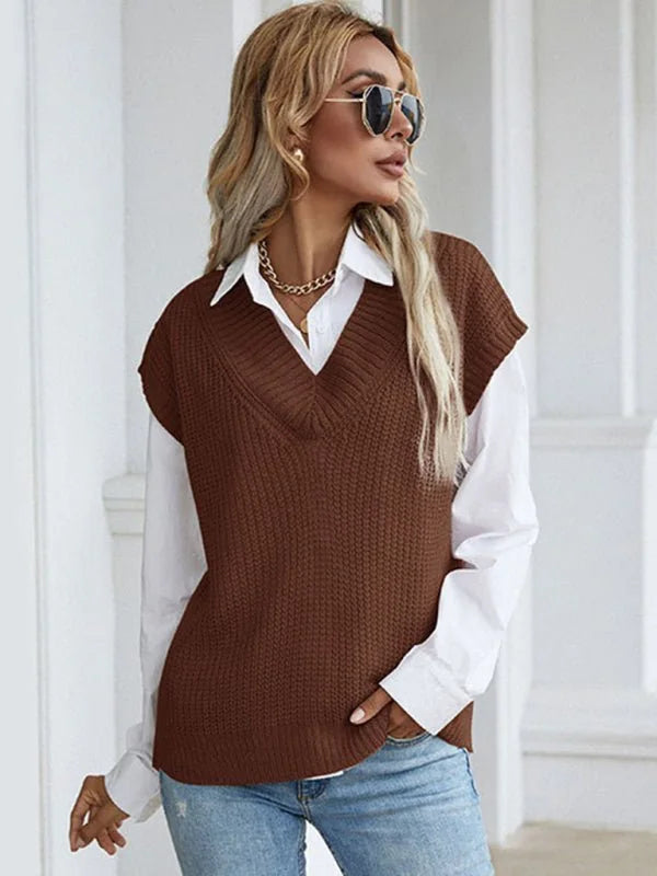 Brown knit v-neck vest with a white collared shirt and light wash jeans on a model.