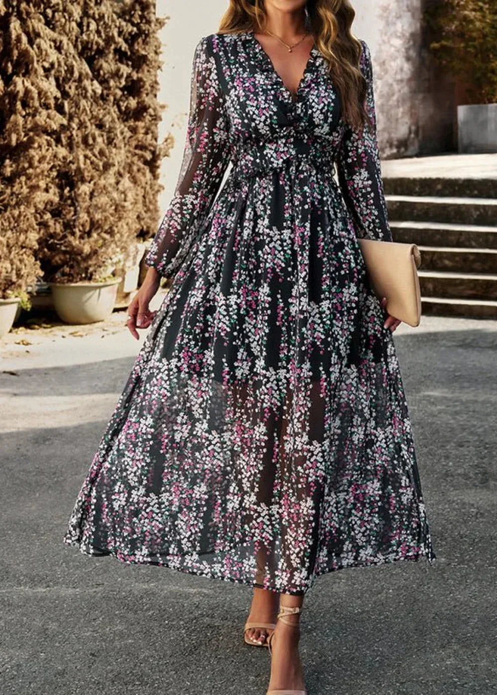 Black floral chiffon maxi dress with v-neck, long sleeves, and cinched waist.