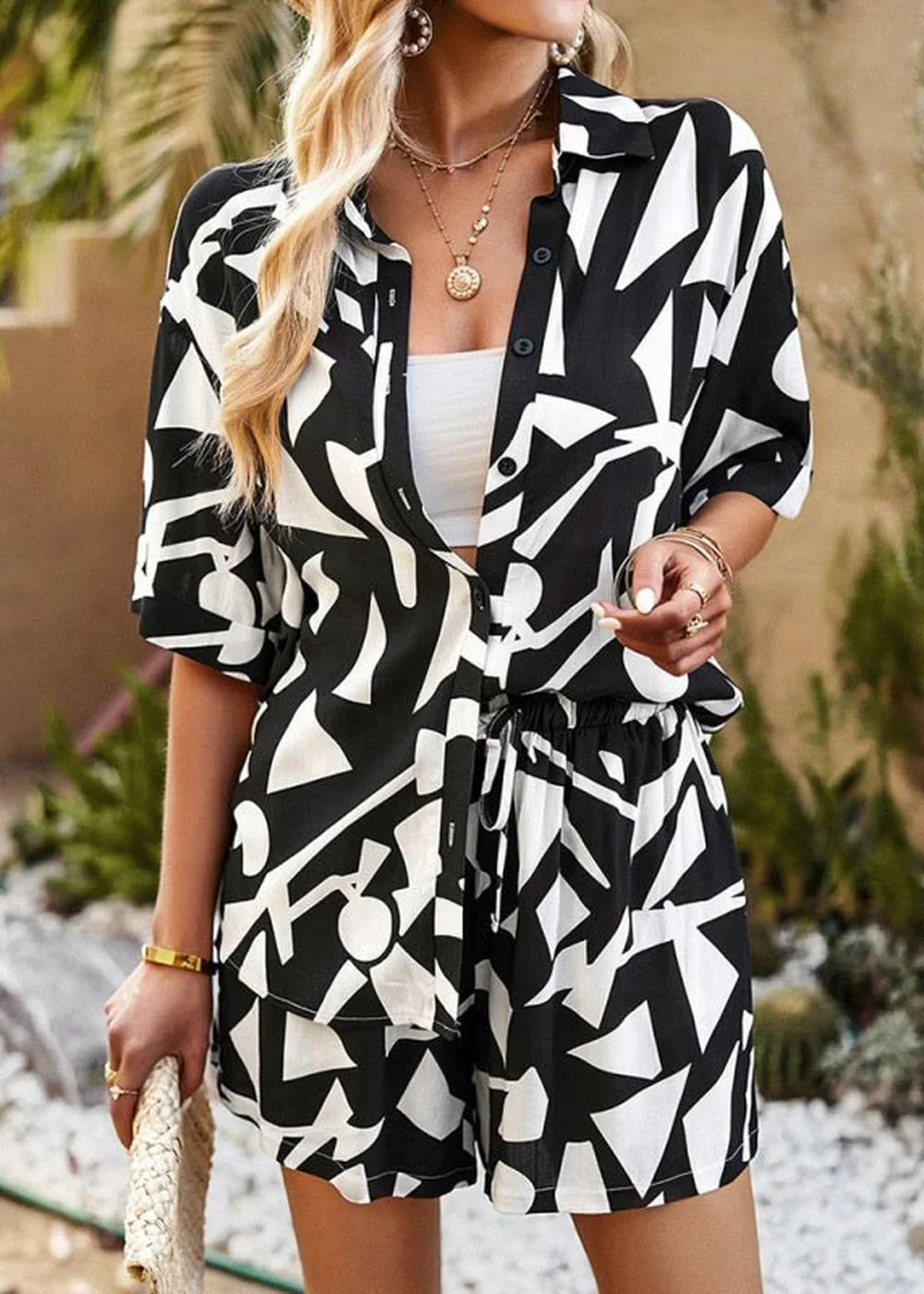Black and white abstract print viscose shirt and shorts set on a model.