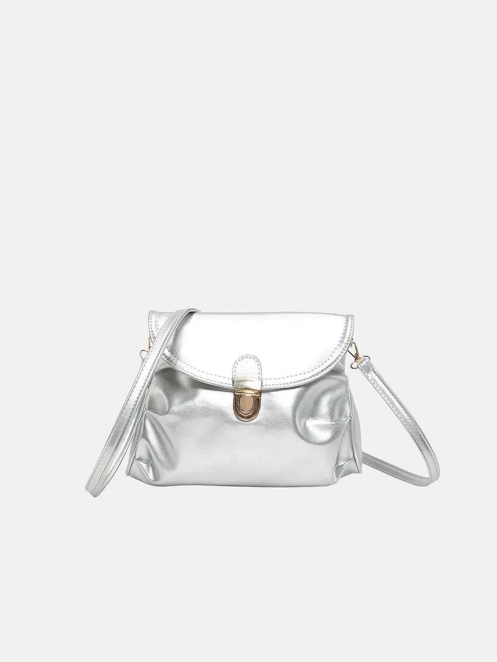 Silver metallic crossbody bag with gold clasp and adjustable strap.