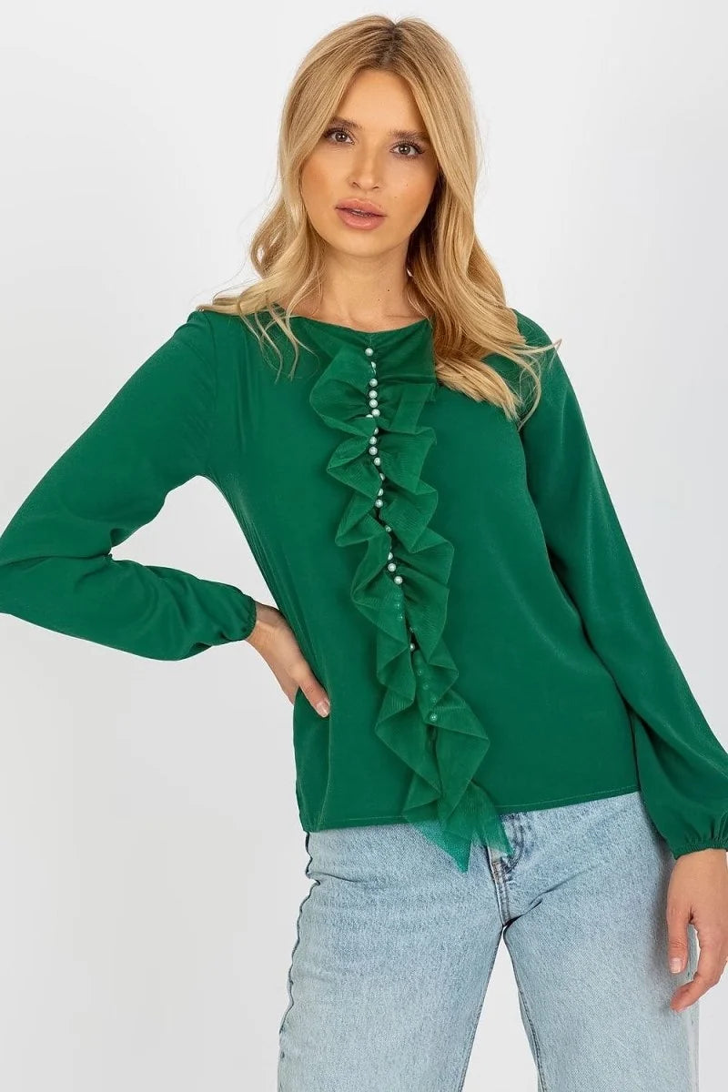 Green long-sleeved top with pearl-buttoned ruffled neckline on a model.