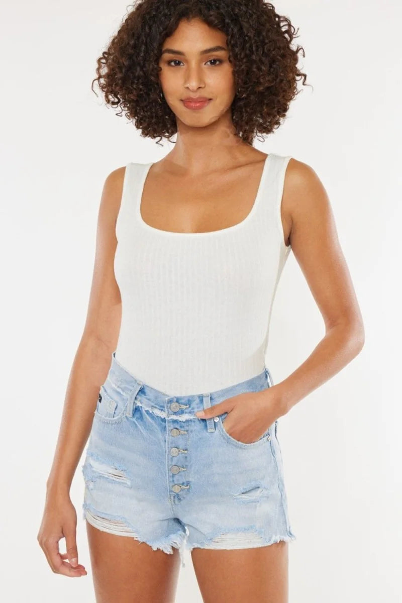 Distressed button fly denim shorts with raw hem