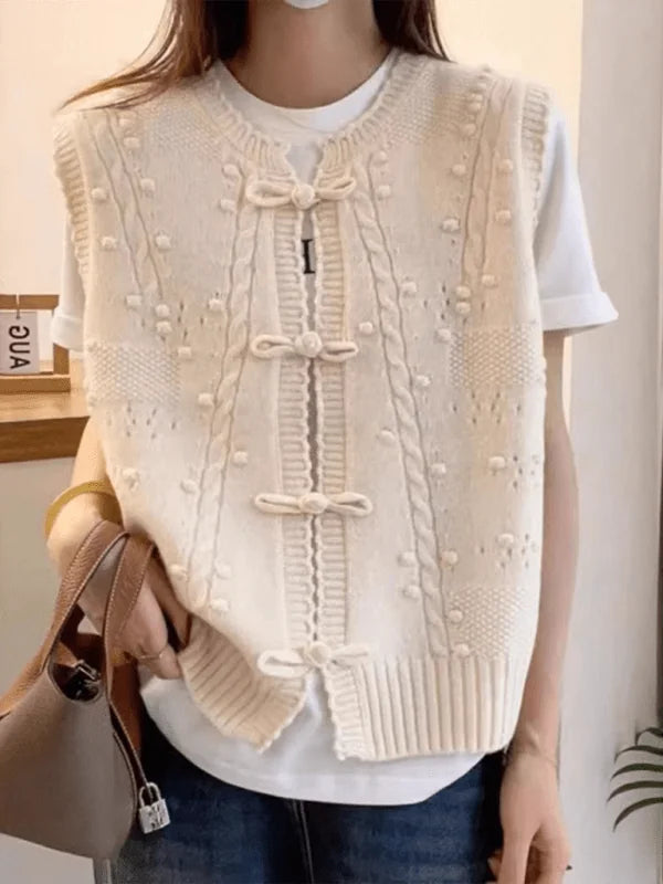 Cream knit vest with lace collar and buckle detail