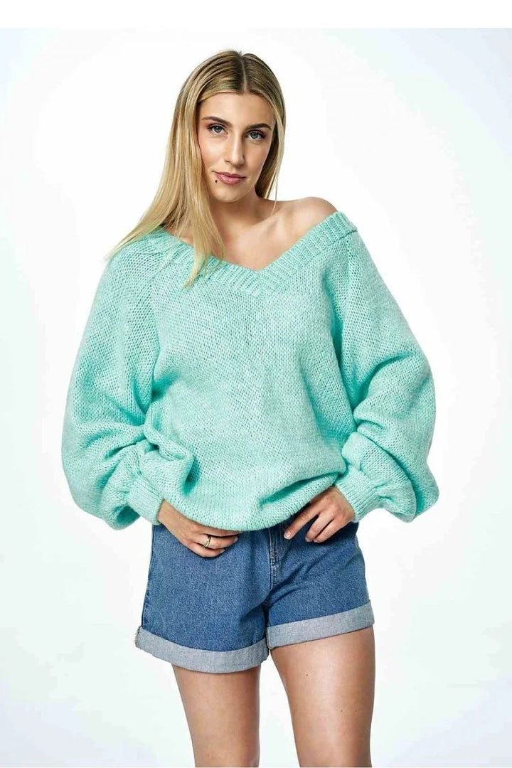 Green V-neck jumper sweater