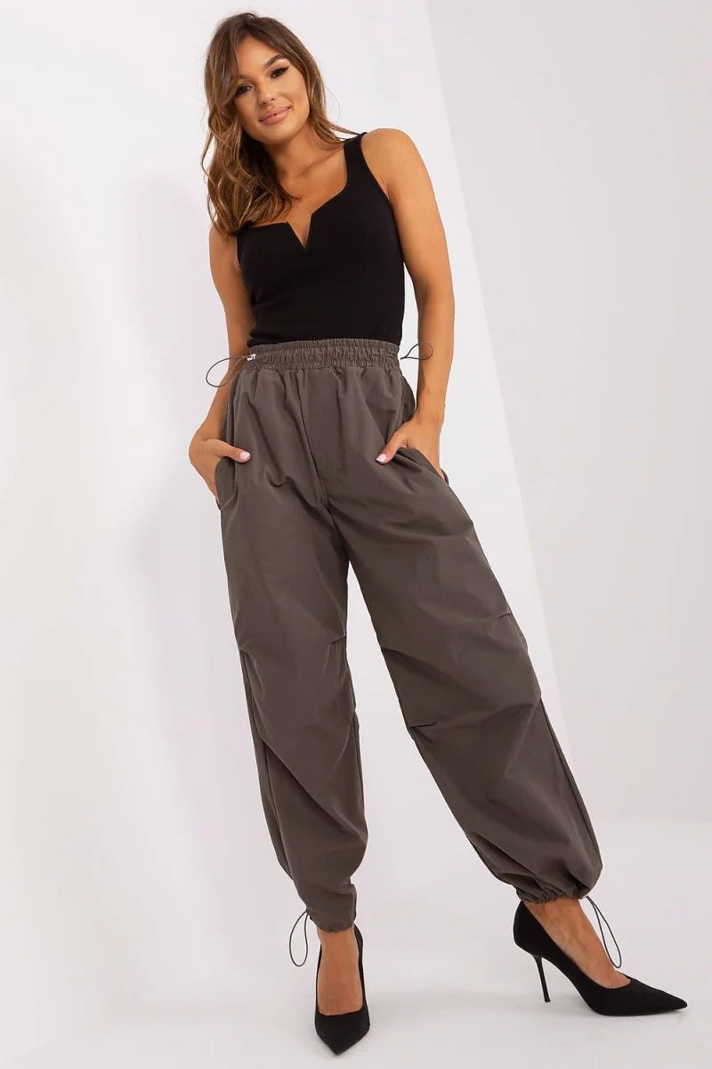 Green parachute trousers with drawstrings