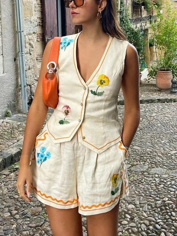 White sleeveless printed vest and bottom set