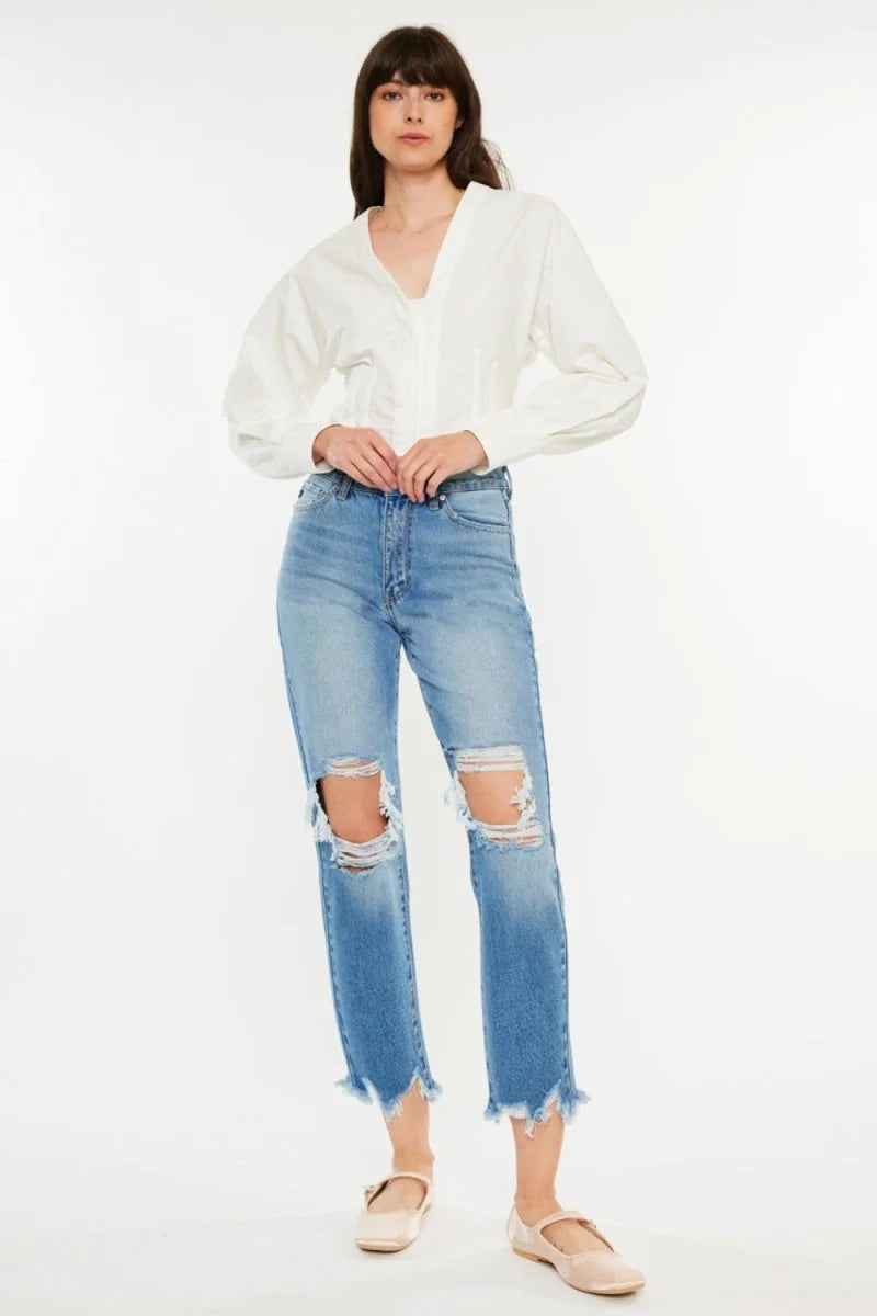 Medium wash distressed cropped jeans with frayed hem