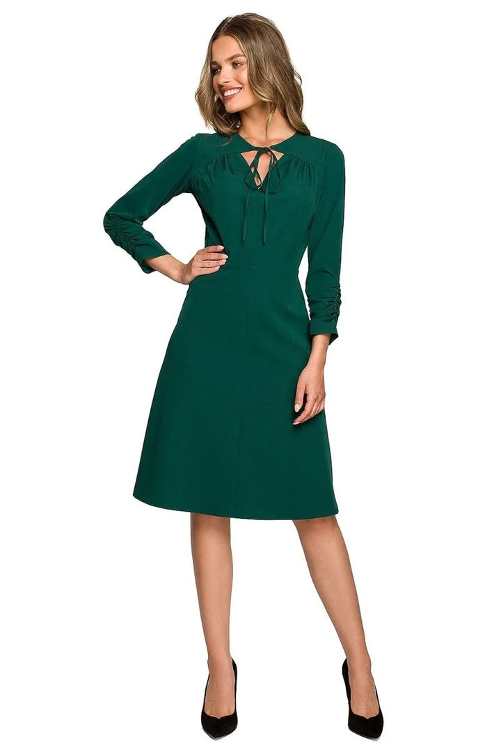 Green day dress with ruffled sleeves