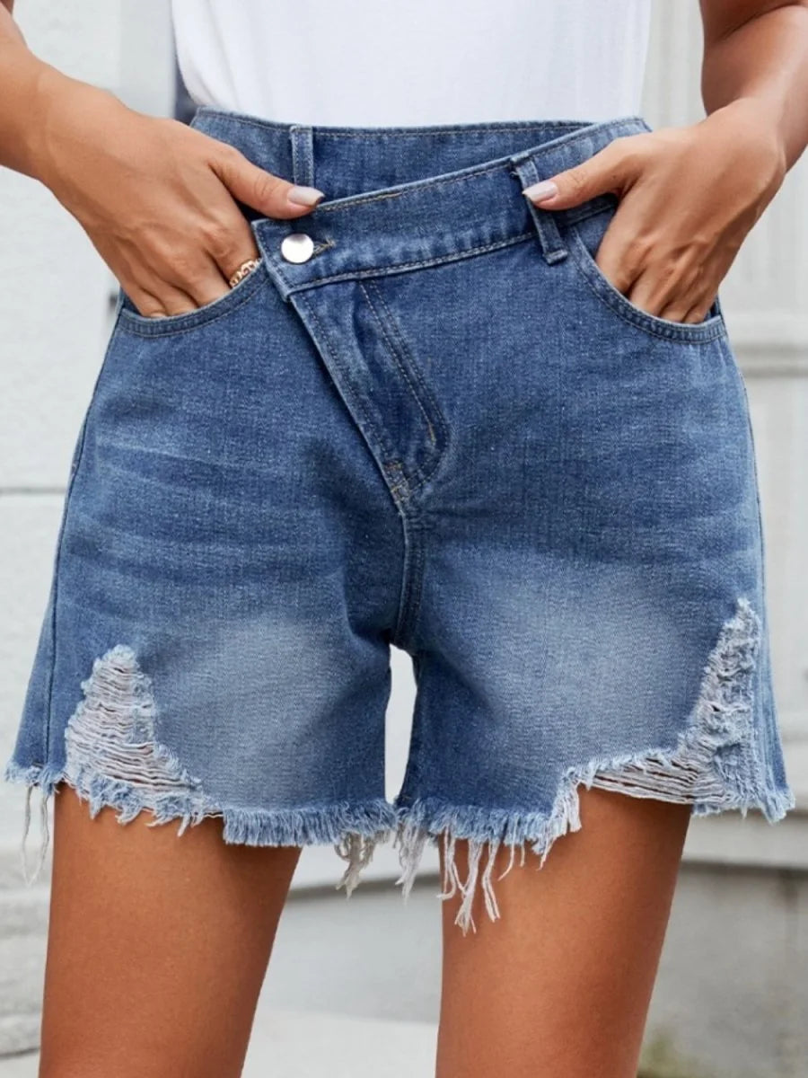 Dusty blue distressed denim shorts with raw hem