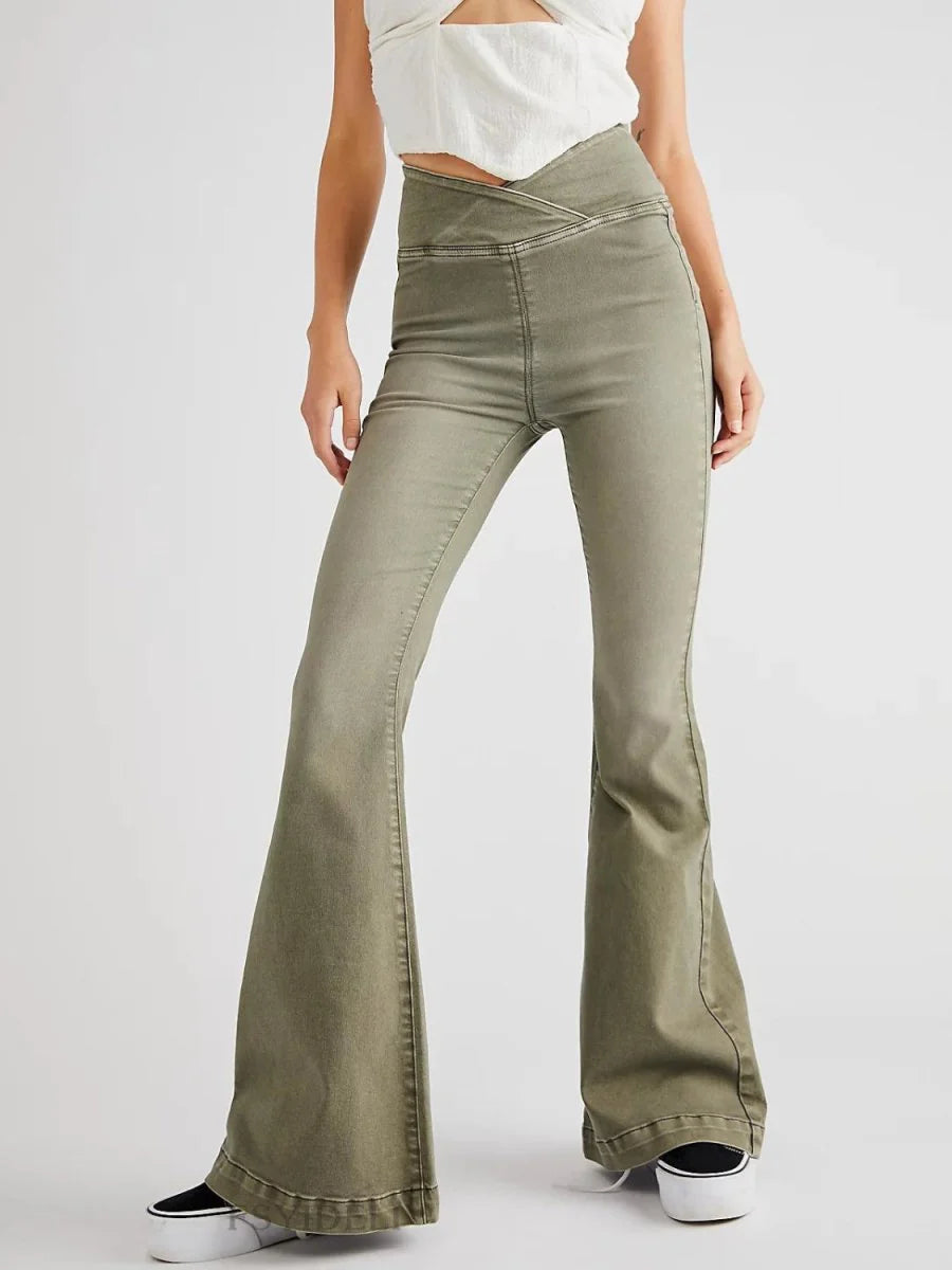 Moss green flared pants with a criss-cross high-waist detail, on a model.