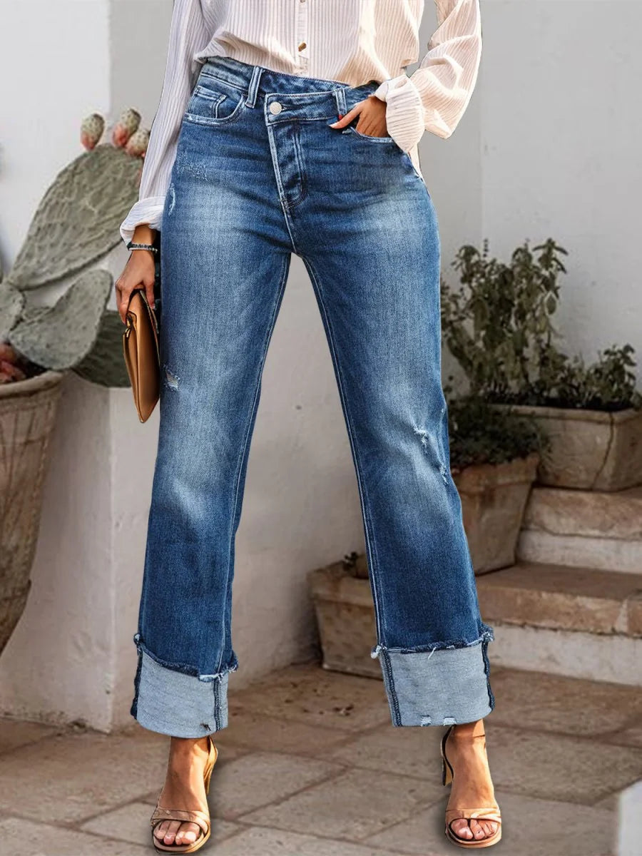 Medium wash stepped waist raw hem straight jeans