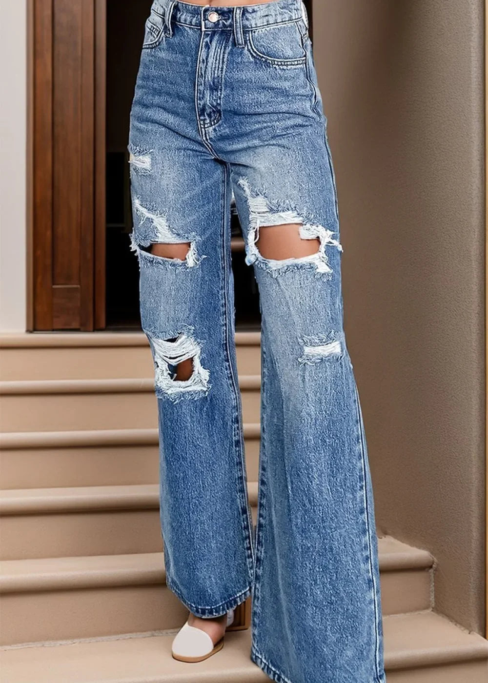 Distressed high waist bootcut jeans in light blue wash